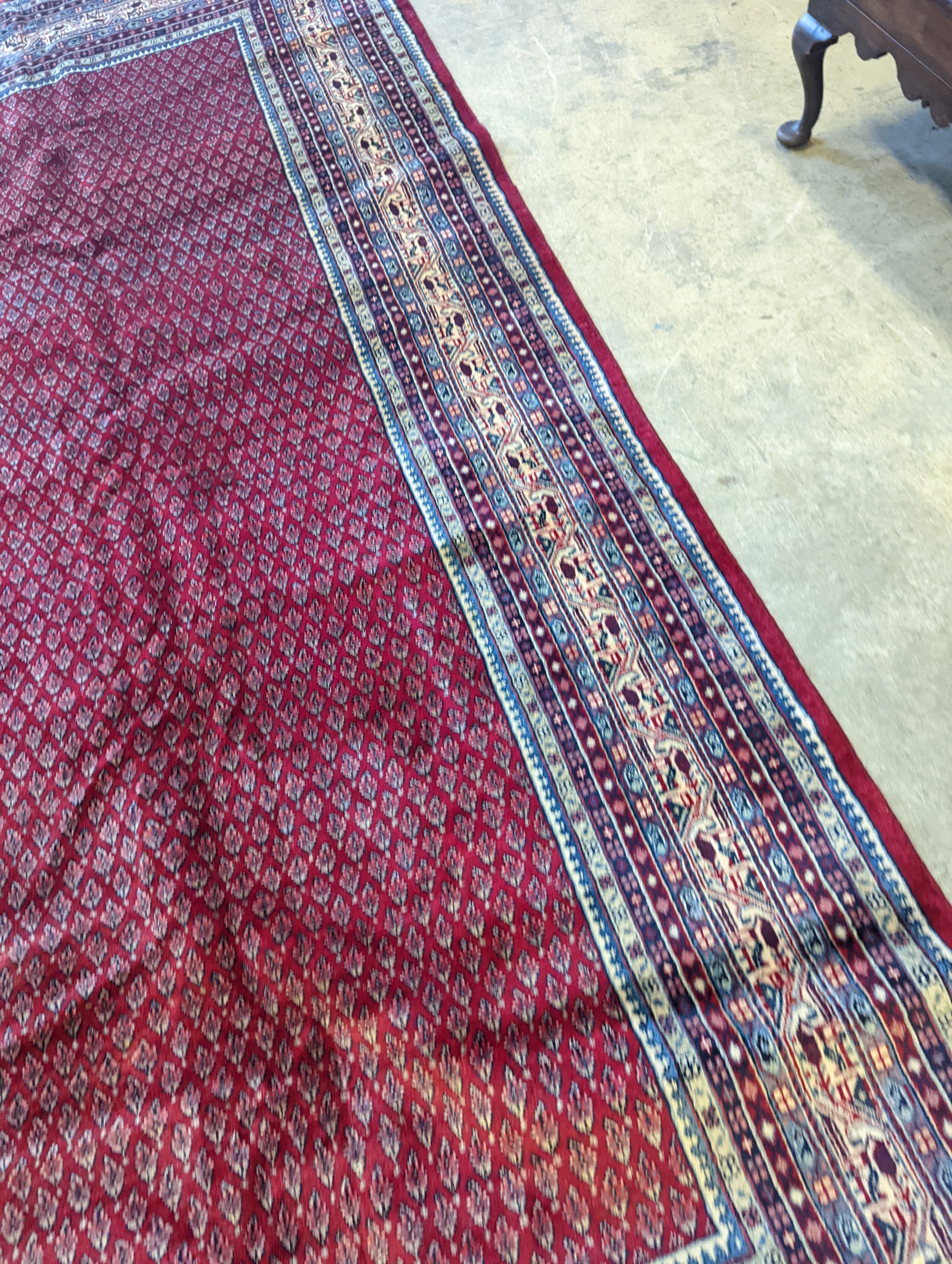 An Araak crimson ground carpet, 350 x 250cm